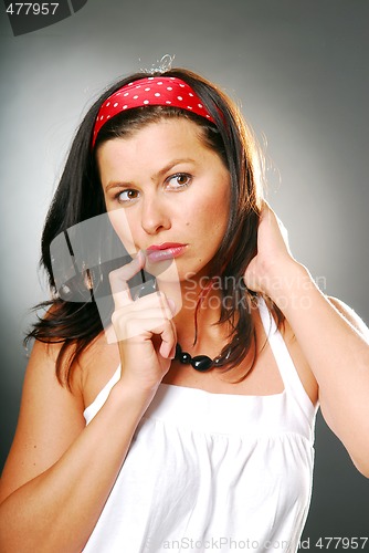 Image of A contemplating young woman in white