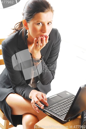 Image of A tired woman with a notebook