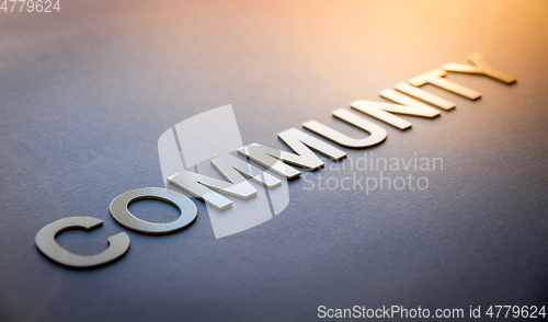 Image of Word community written with white solid letters