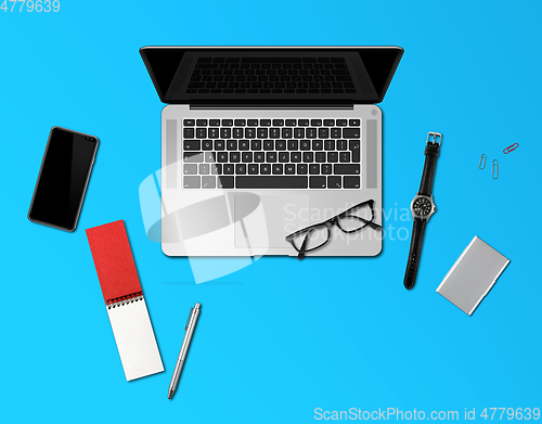 Image of Office desk mockup top view isolated on blue