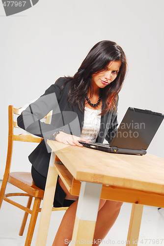 Image of A tired woman with a notebook