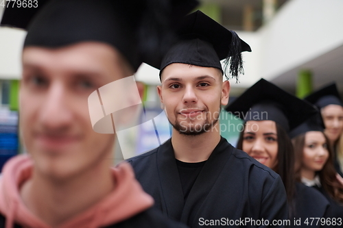 Image of Group of diverse international graduating students celebrating