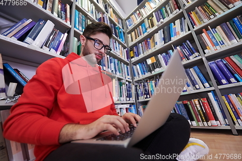 Image of the students uses a notebook, laptop and a school library