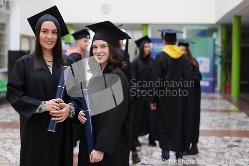 Image of Group of diverse international graduating students celebrating