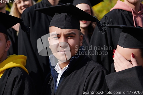 Image of Group of diverse international graduating students celebrating