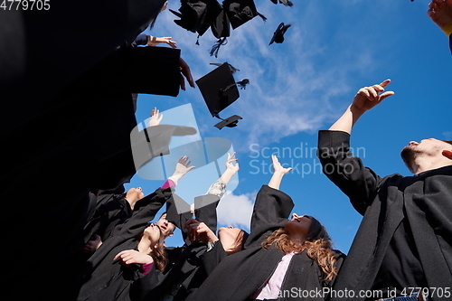 Image of Group of diverse international graduating students celebrating