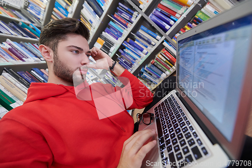 Image of the students uses a notebook, laptop and a school library