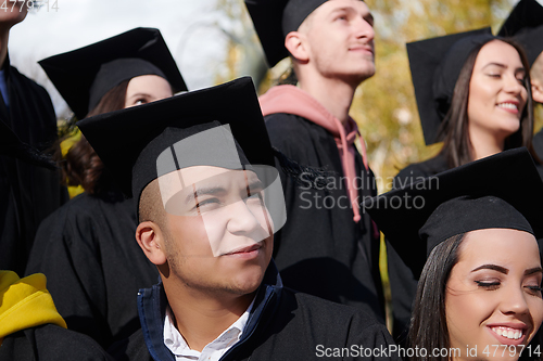 Image of Group of diverse international graduating students celebrating