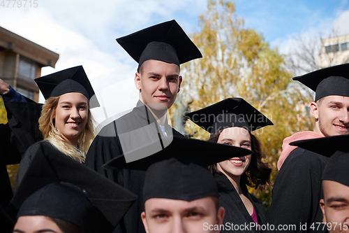 Image of Group of diverse international graduating students celebrating