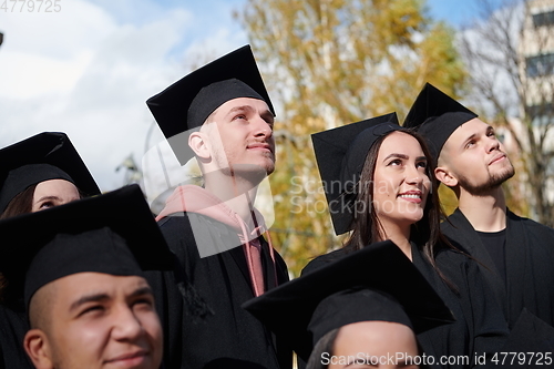 Image of Group of diverse international graduating students celebrating