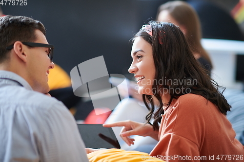 Image of students using modern technology for school project