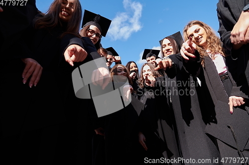 Image of Group of diverse international graduating students celebrating