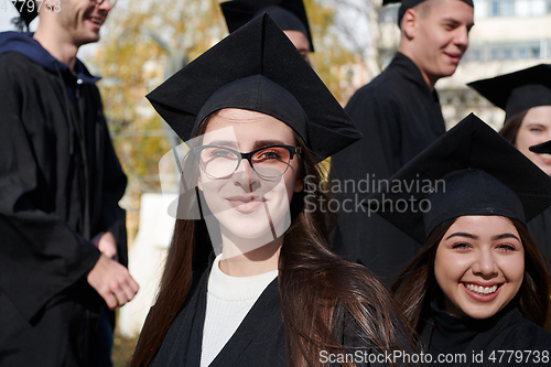 Image of Group of diverse international graduating students celebrating