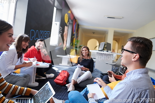 Image of students using modern technology for school project