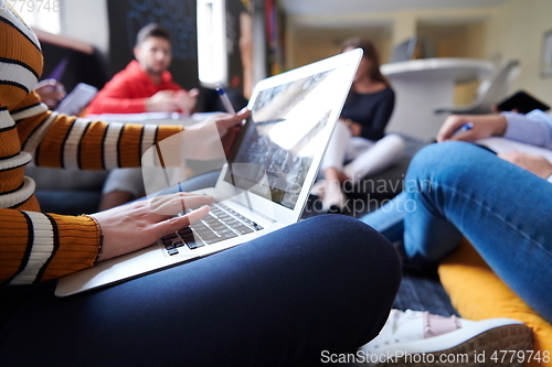 Image of students using modern technology for school project