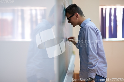 Image of the student does the task on the board