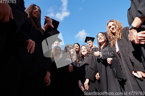 Image of Group of diverse international graduating students celebrating