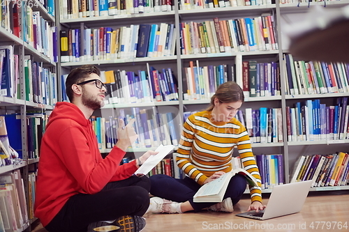 Image of the students uses a notebook, laptop and a school library