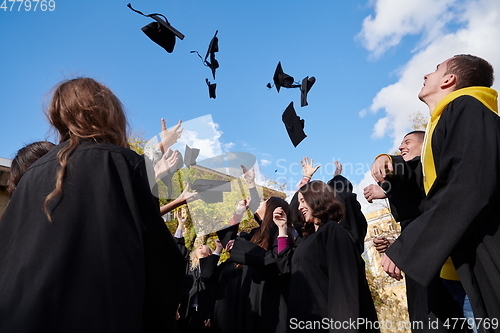 Image of Group of diverse international graduating students celebrating