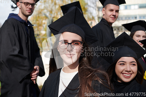 Image of Group of diverse international graduating students celebrating