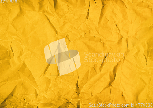 Image of yellow crumpled paper texture background