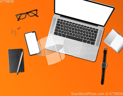Image of Office desk mockup top view isolated on orange