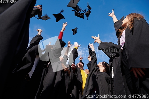 Image of Group of diverse international graduating students celebrating