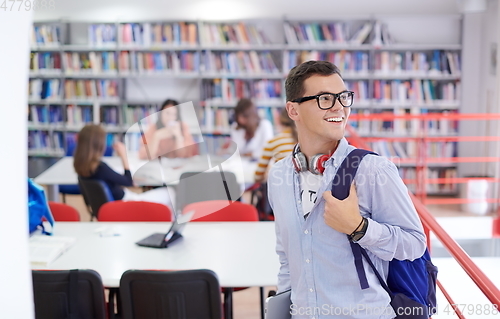 Image of the student uses a notebook, latop and a school library