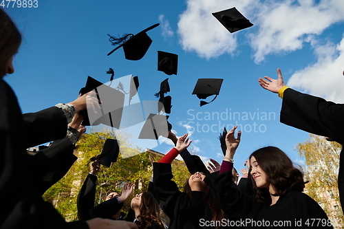 Image of Group of diverse international graduating students celebrating