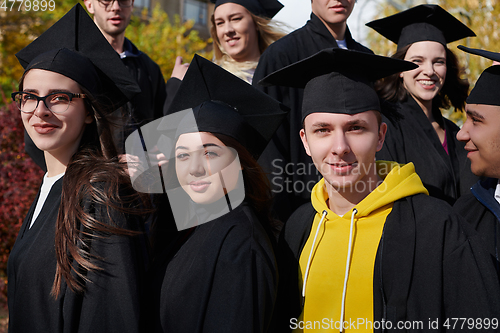 Image of Group of diverse international graduating students celebrating