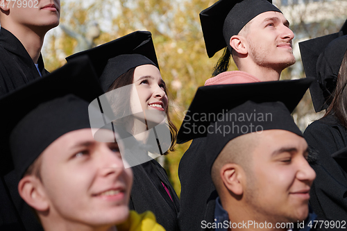 Image of Group of diverse international graduating students celebrating