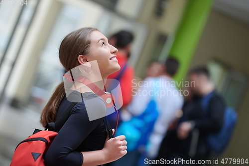 Image of famel student with modern technology in school