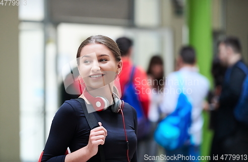 Image of famel student with modern technology in school