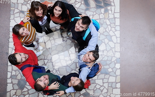 Image of group of happy young people showing their unity.