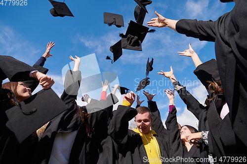 Image of Group of diverse international graduating students celebrating