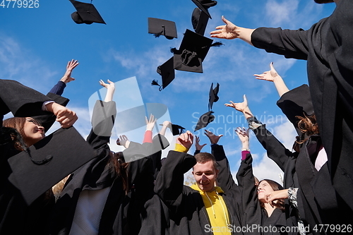 Image of Group of diverse international graduating students celebrating