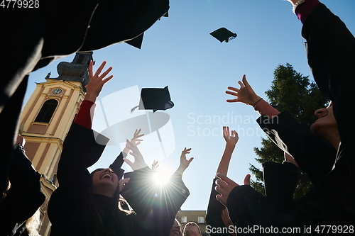 Image of Group of diverse international graduating students celebrating