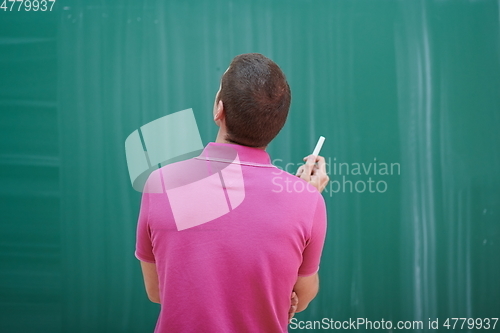 Image of the student does the task on the board