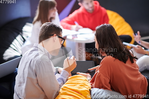 Image of students using modern technology for school project