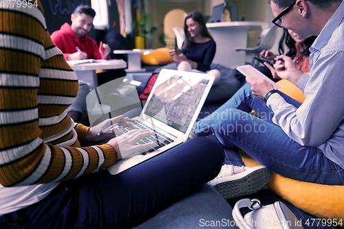 Image of students using modern technology for school project