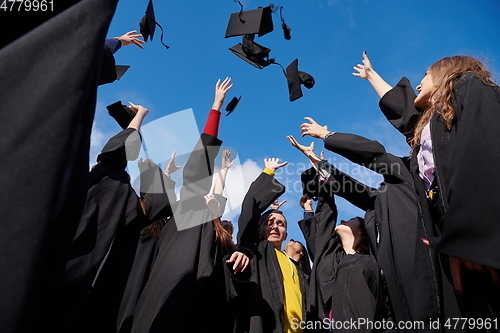 Image of Group of diverse international graduating students celebrating