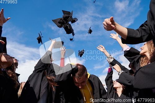 Image of Group of diverse international graduating students celebrating