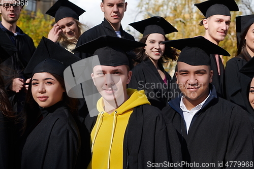 Image of Group of diverse international graduating students celebrating