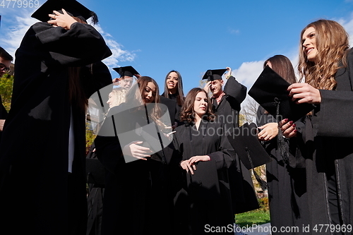 Image of Group of diverse international graduating students celebrating