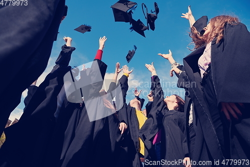 Image of Group of diverse international graduating students celebrating