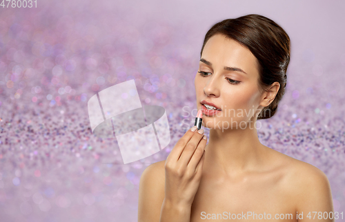 Image of beautiful smiling young woman with pink lipstick