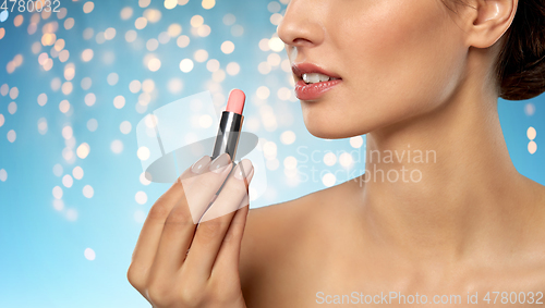 Image of beautiful smiling young woman with pink lipstick