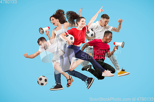 Image of Men and women jumping on blue background