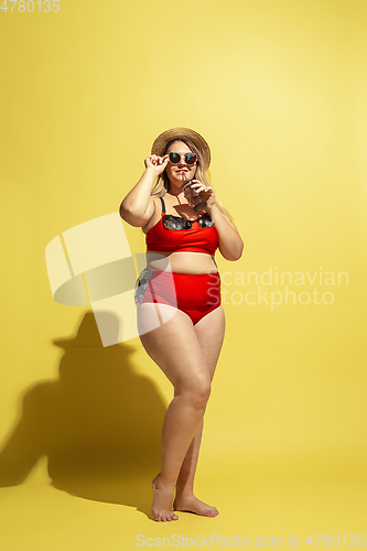 Image of Young caucasian plus size female model\'s preparing for beach resort