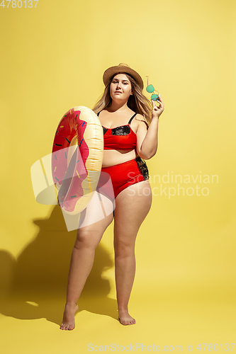 Image of Young caucasian plus size female model\'s preparing for beach resort